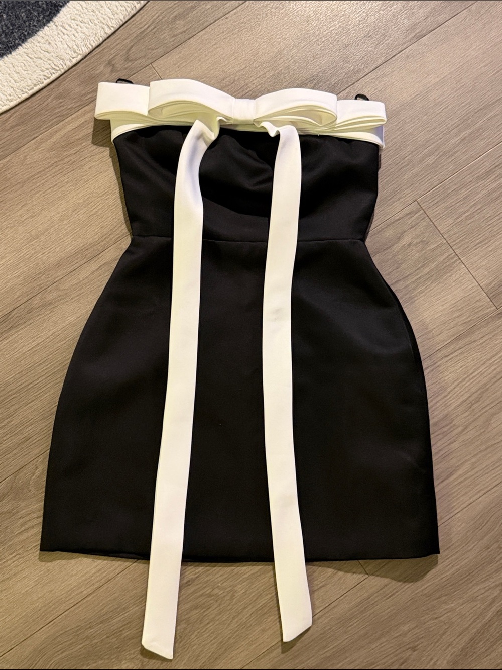 Strapless Black Dress with White Bow Accent